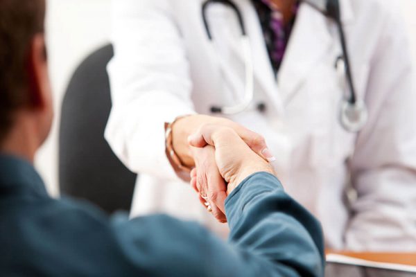 doctor shaking patients' hands